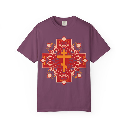 Berry-colored heavyweight cotton unisex tee featuring an ornate orange and red Orthodox cross with festive floral accents centered on the front, inscribed with "By His Wounds You Have Been Healed" (1 Peter 2:24).
