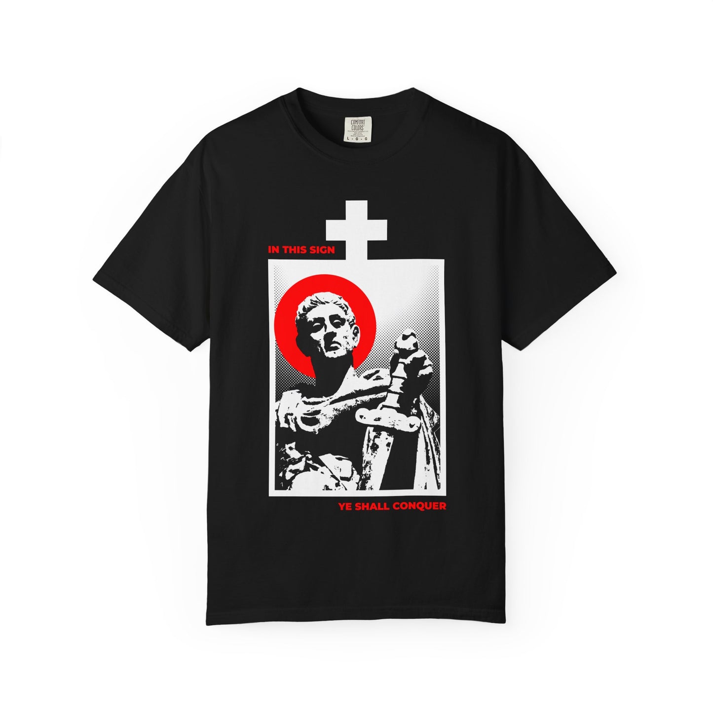 Black heavyweight cotton unisex T-shirt featuring a statue of St Constantine the Great with sword, red halo, white cross, and "IN THIS SIGN YE SHALL CONQUER" text—reminding you to conquer your passions and take up your cross.