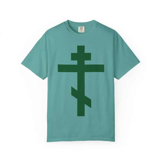 A seafoam heavyweight cotton unisex tee featuring a prominent forest green Orthodox tribar cross on the front, inspired by the Troparion “Preserve Thy People By Thy Cross, O Lord” and St. John of Kronstadt.