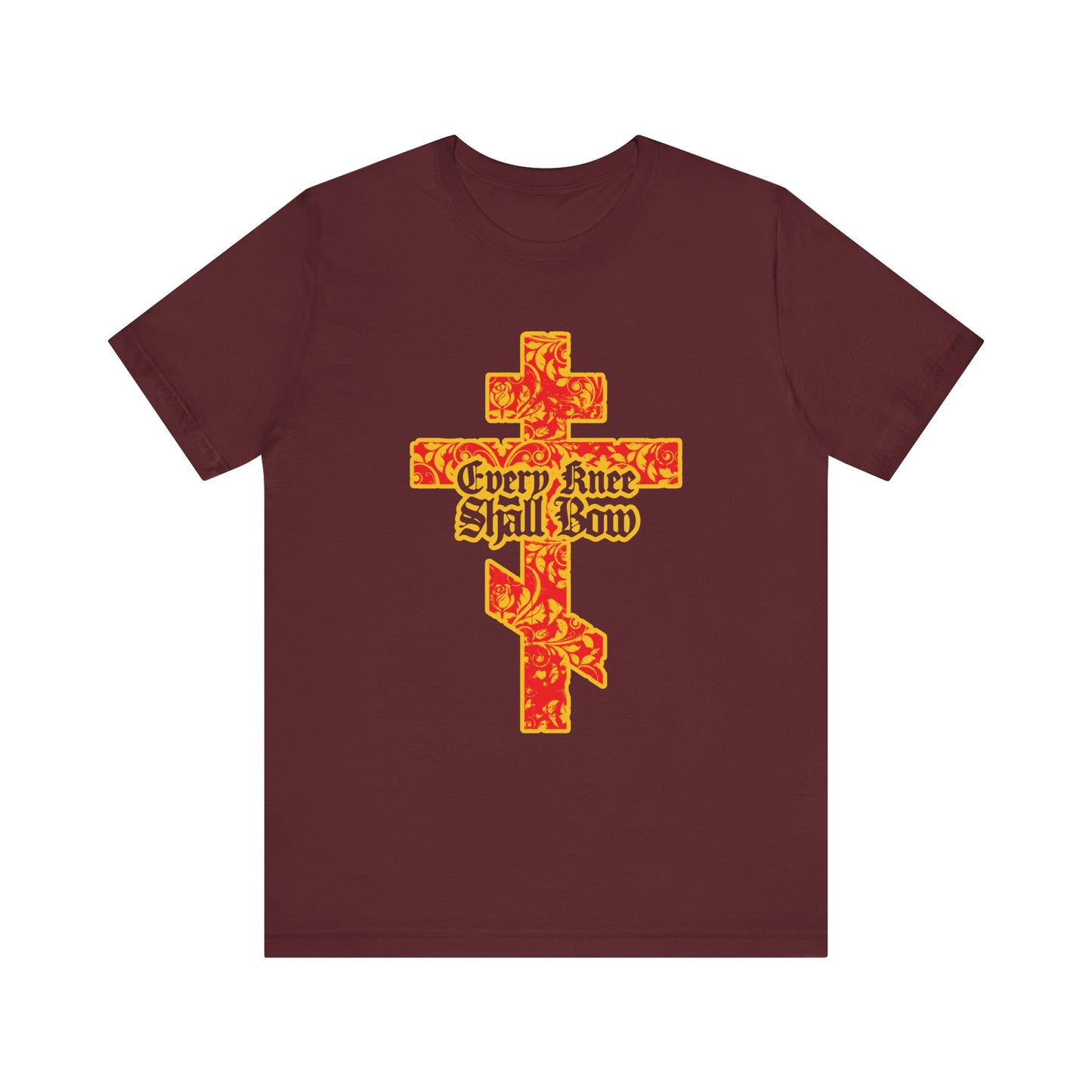Maroon lightweight cotton unisex tee featuring a gold and red floral-textured Orthodox cross with gothic “Every Knee Shall Bow” lettering, inspired by Isaiah 45:22-24 & Philippians 2:7-11.