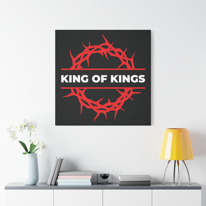 King of Kings Crown of Thorns | The King of Glory canvas art, inspired by Revelation 19:16, features bold "Christ is King" text and depicts the red crown of thorns—perfect above a white console table and yellow lamp.