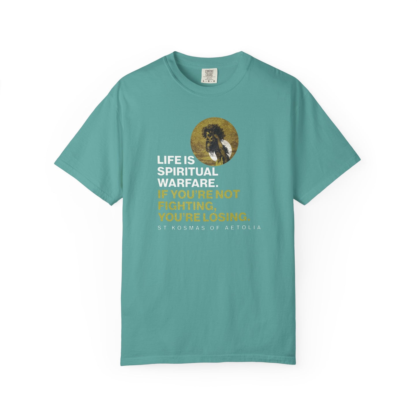 Seafoam heavyweight cotton tee featuring St. Kosmas of Aetolia, Gustave Dore's David & Goliath, and the quote “Life is spiritual warfare,” inspired by Psalm 151 and Unseen Warfare. Orthodox unisex fit.