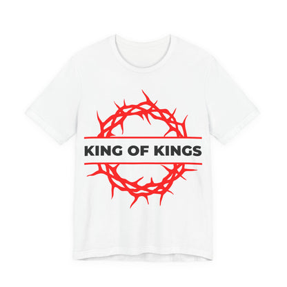 White cotton unisex tee with a red crown of thorns graphic and KING OF KINGS text, inspired by Revelation 19:16. Christ is King—The King of Glory Orthodox Christian design.