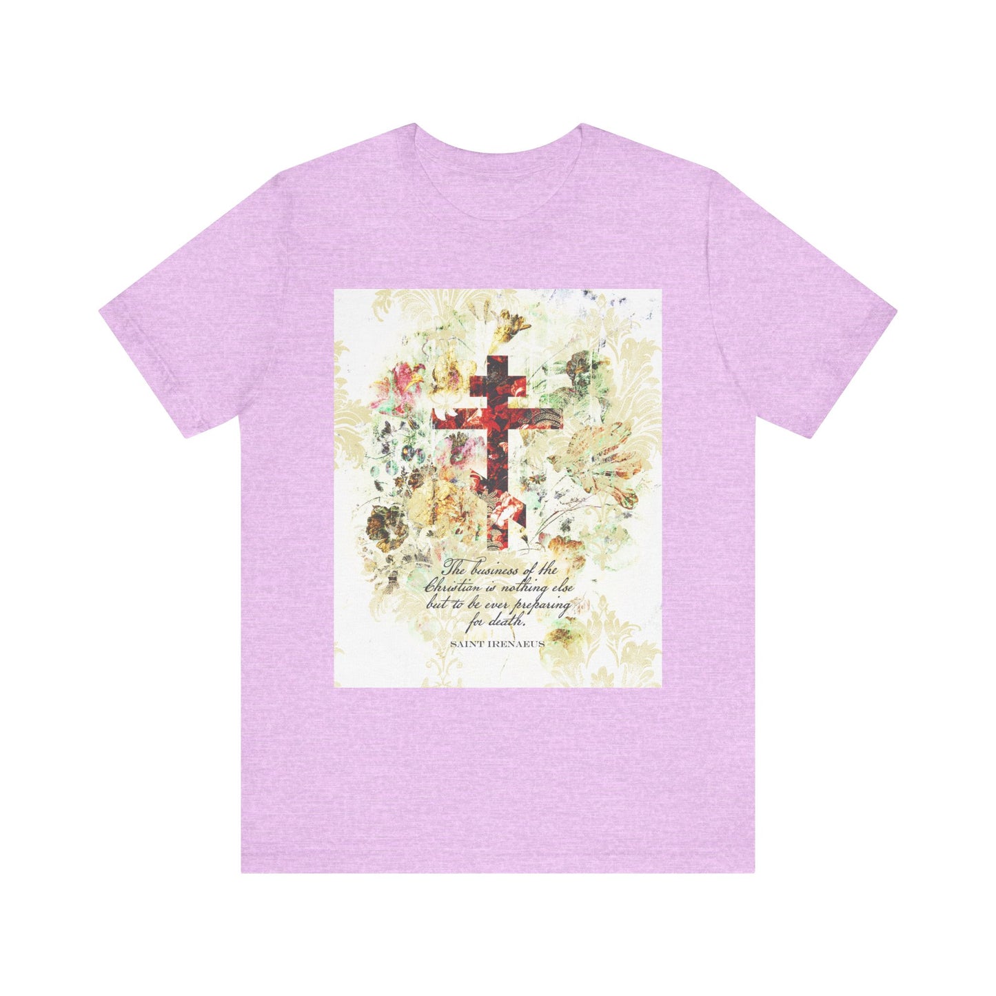Heather Prism Lilac lightweight cotton unisex tee featuring a white and beige floral scrapbook-textured cross with arts & crafts style, inspired by St. Irenaeus and reflecting themes of Christian preparation for death—design printed on the front center.