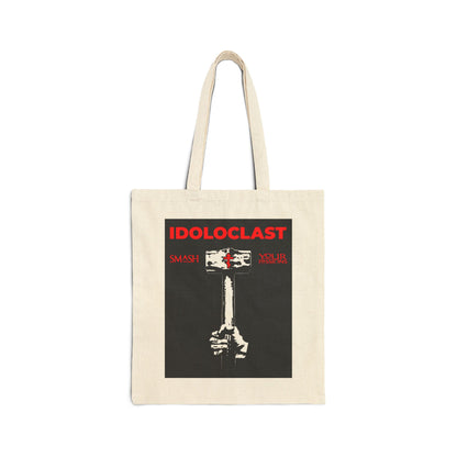 Natural tote bag featuring a graphic of Jesus’ fist with a sledgehammer and "IDOLOCLAST"—inspired by Orthodox Christian asceticism and St. Macarius of Optina. ICXC NIKA. Smash your passions with style.