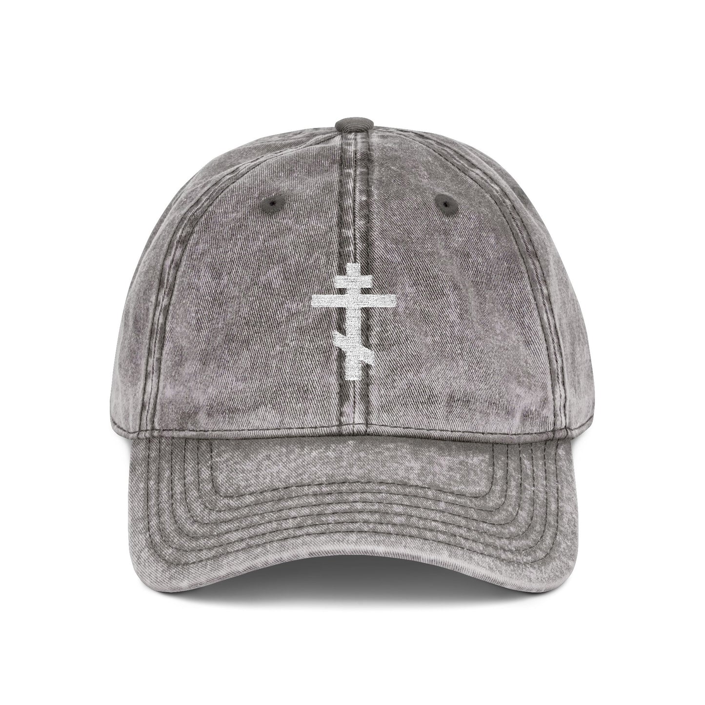 Charcoal grey distressed cap featuring a simple white Orthodox TriBar cross embroidered on the front, symbolizing crucifixion and personal humility. Minimalist Christian design: "Crucify My Ego to the Precious and Life Giving Cross.