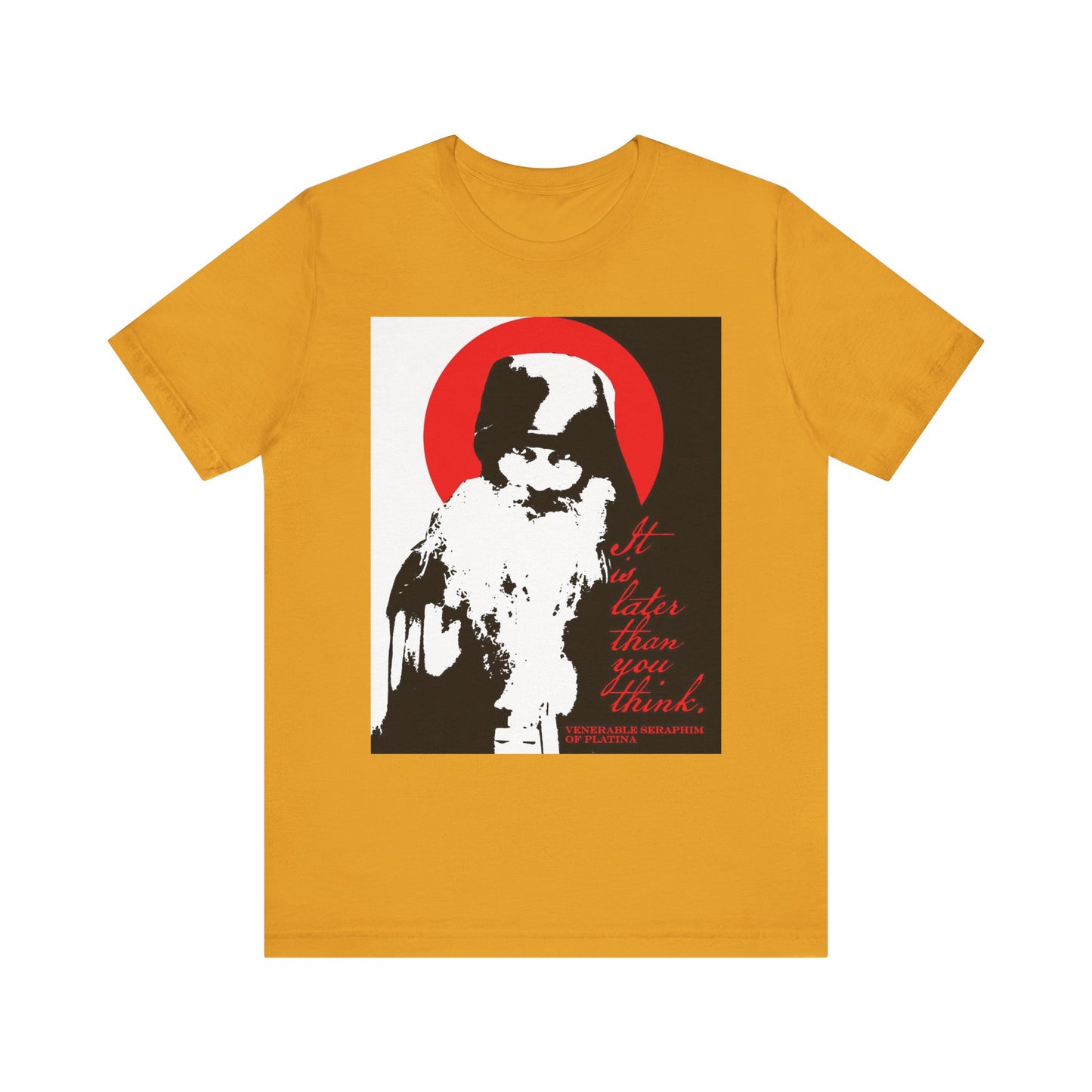 A mustard-colored lightweight cotton unisex t-shirt featuring a striking black, white, and red high-contrast design with a bearded figure and the phrase "It is later than you think"—a thoughtful tribute to Fr. Seraphim Rose and Orthodox spiritual reflection.