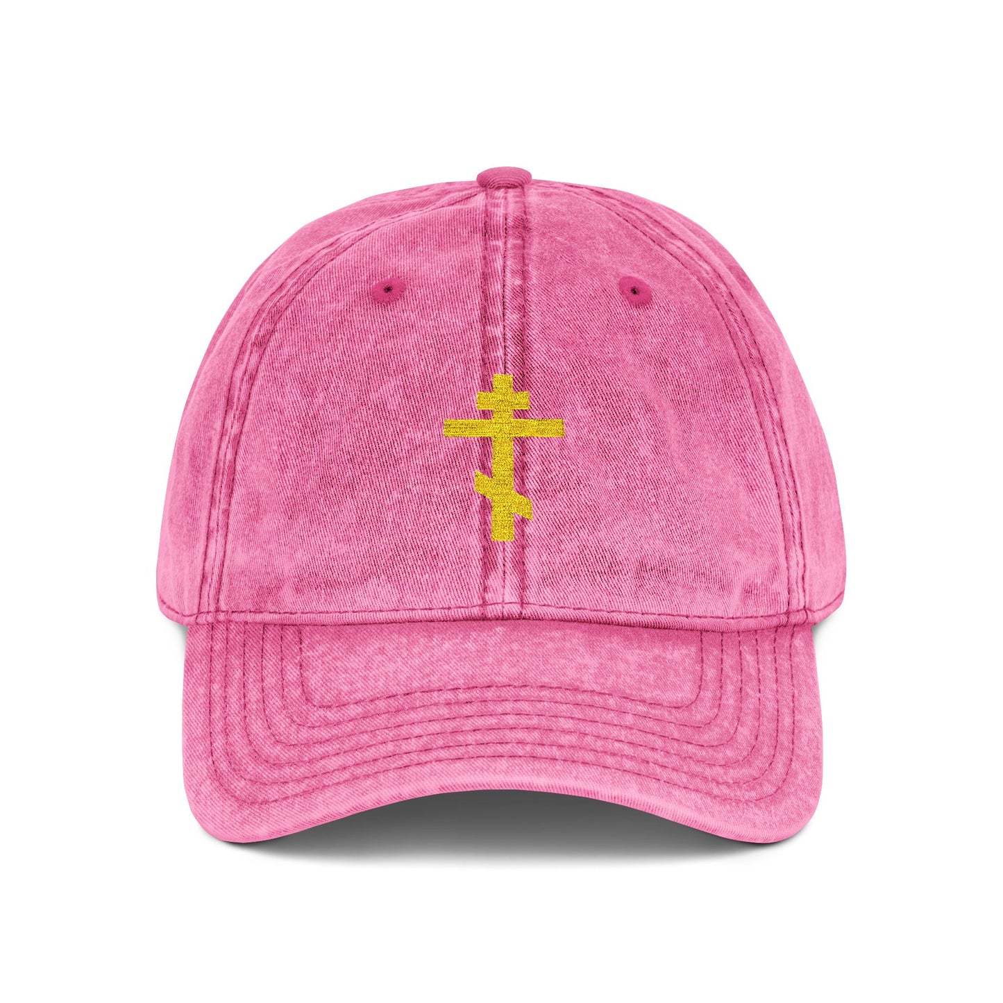 Simple yellow Orthodox TriBar Cross cap in bright pink, featuring minimalist embroidery and "Crucify My Ego to the Precious and Life Giving Cross" design; a distressed Christian statement accessory.