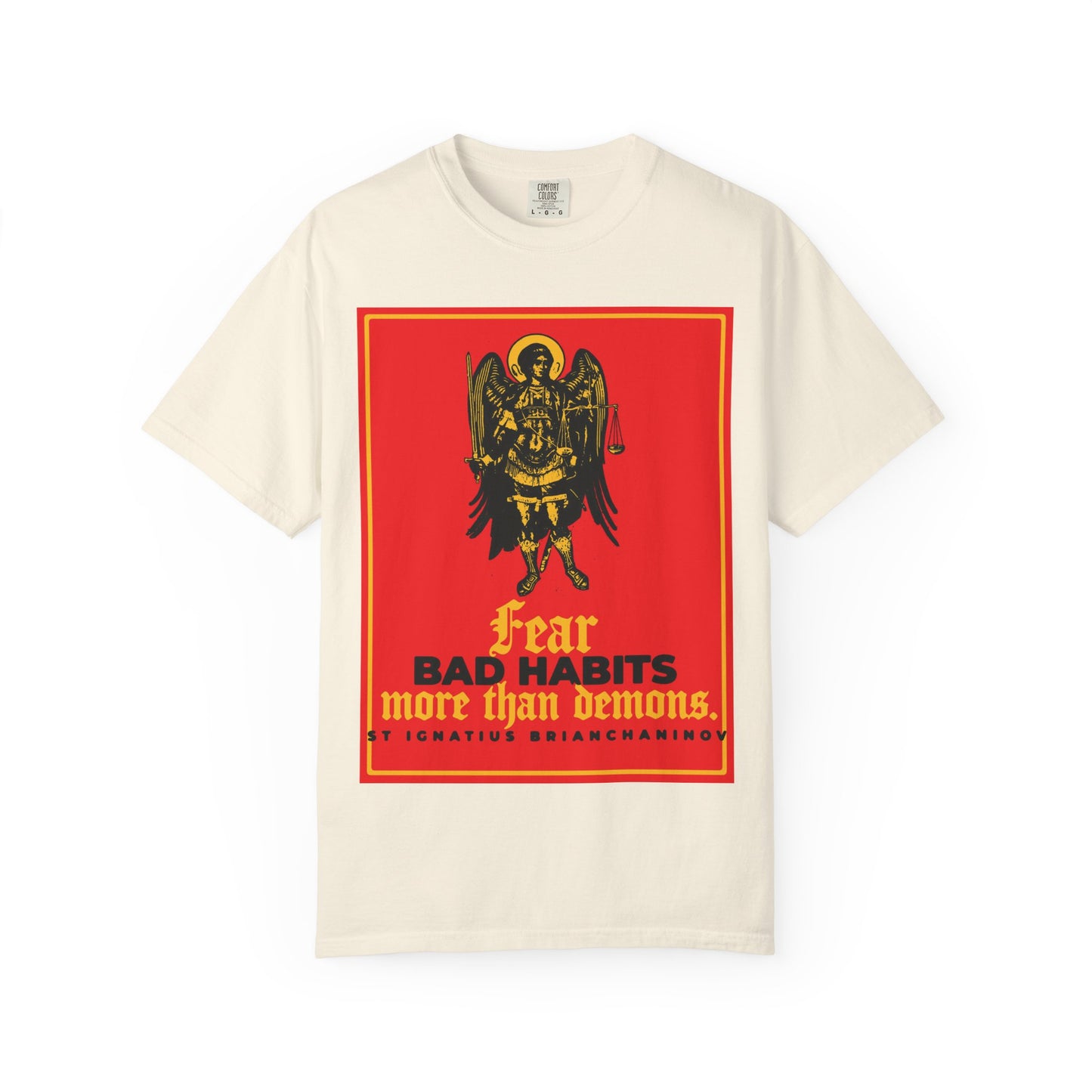 Ivory heavyweight cotton unisex tee featuring an Archangel Michael icono-graphic and the quote, “Fear bad habits more than demons,” inspired by St. Ignatius Brianchaninov—a reminder of our inner spiritual struggle.