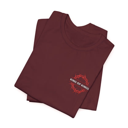 Folded maroon King of Kings Crown of Thorns Orthodox Christian cotton unisex embroidered tee, featuring a red crown of thorns and KING OF KINGS chest text, inspired by Revelation 19:16.