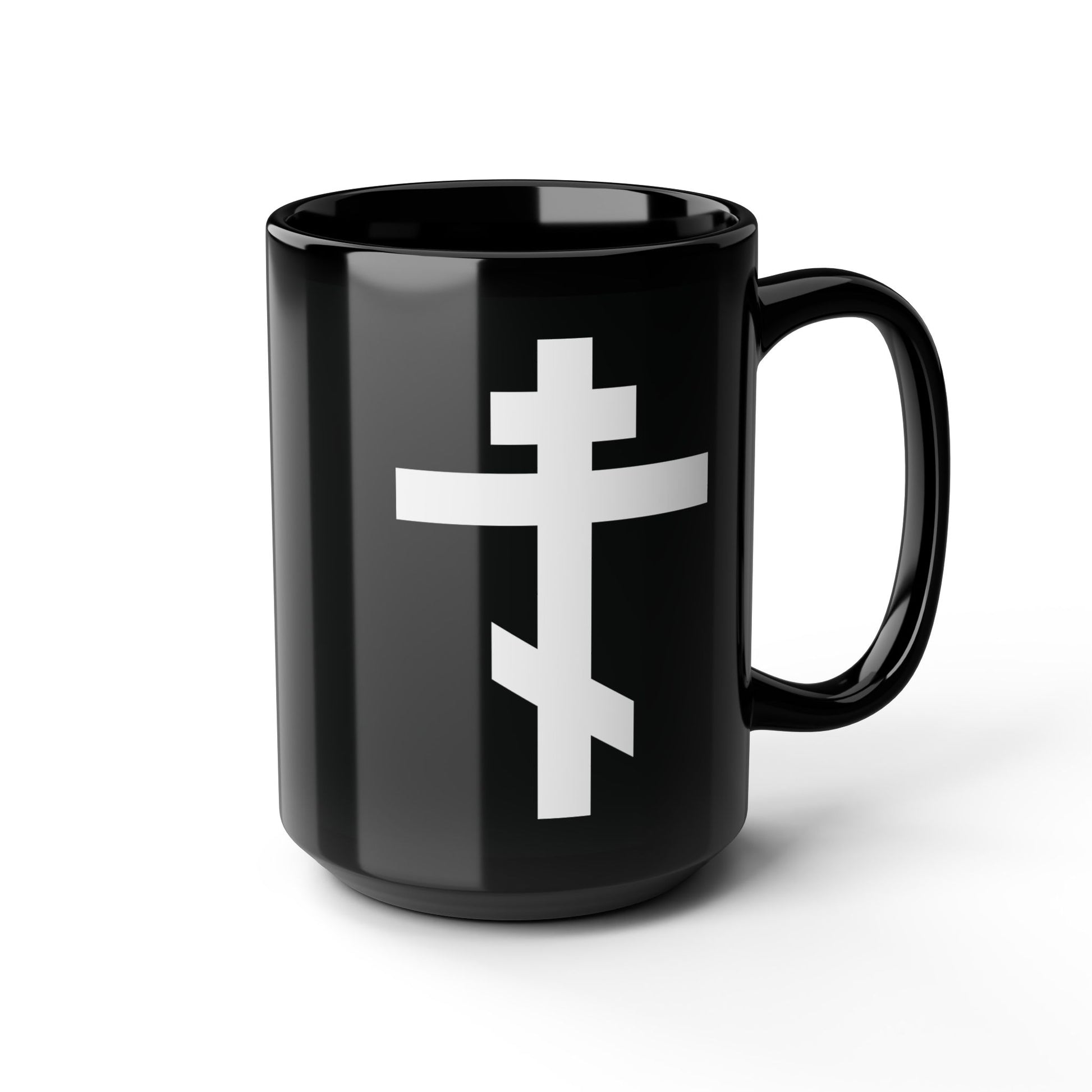 A black mug with a white Orthodox cross and the inscription “May I never boast, except in the cross of our Lord Jesus Christ” (Gal 6:14), inspired by St. John of Kronstadt and the Saviour’s sacrifice.