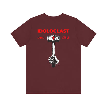 Maroon lightweight cotton unisex tee featuring a JESUS NIKA fist holding a sledgehammer with "SMASH YOUR PASSIONS" in bold red text on the back, plus a red cross on the front left breast—a striking statement inspired by the Evangelical Commandments and a call to pursue your Divine Life.