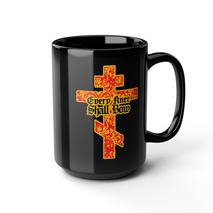 This black mug features a gold and red floral texture Orthodox cross with Gothic lettering and the phrase "Every Knee Shall Bow," inspired by Isaiah 45:22-24 and Phil 2:7-11.