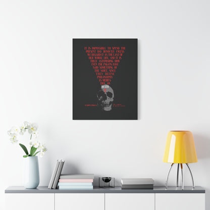 A modern room featuring "The Present Day As the Last Day of Our Life" Orthodox canvas wall art with a skull and red cross, displayed above a white console with flowers, books, and a yellow lamp.