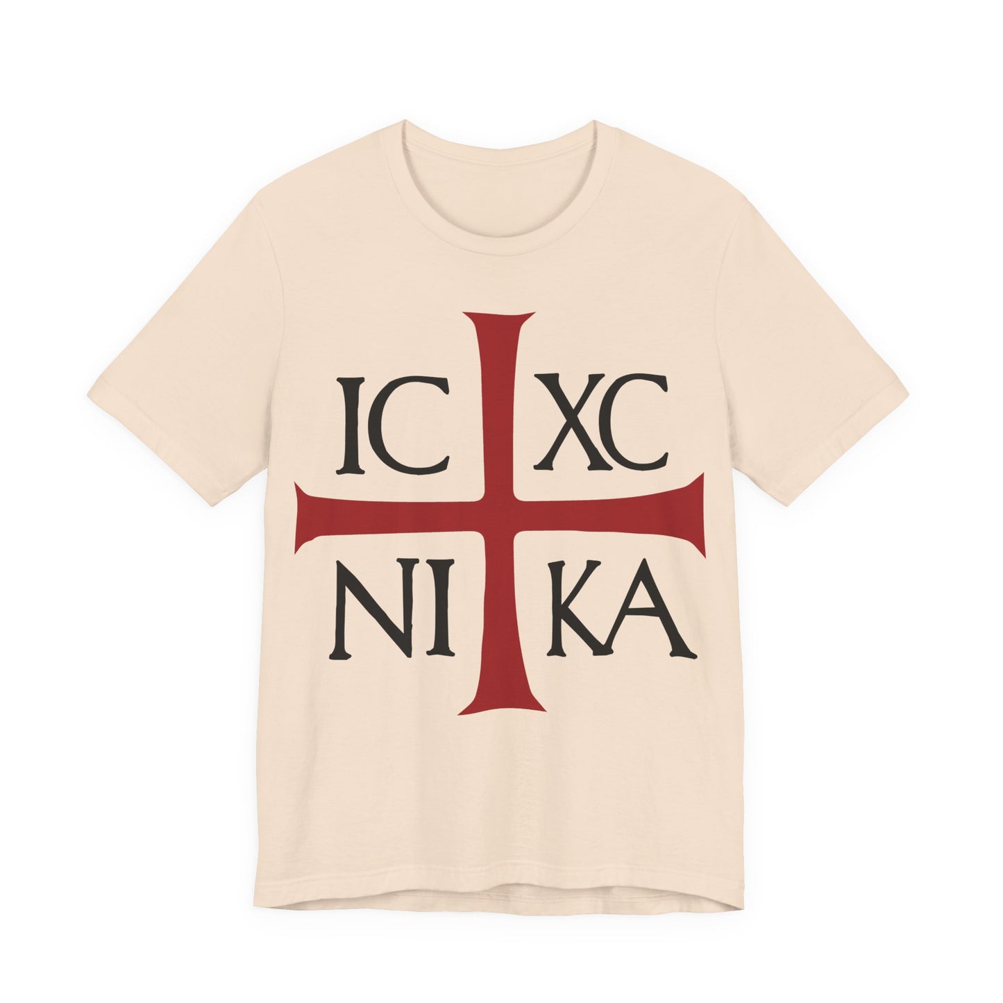 Soft cream cotton t-shirt featuring a red cross and black ICXC NIKA letters—an ancient Byzantine Christogram meaning "Jesus Christ Conquers"—printed on the front.