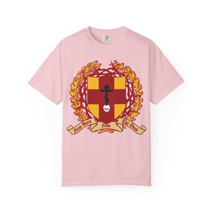 Blossom heavyweight cotton unisex t-shirt featuring a heraldic shield with an Orthodox cross stabbing a skull, crowned by thorns—alongside a laurel wreath and ribbon reading “First-Born from the Dead”—a striking design inspired by Colossians 1:18 and the promise of redemption through His blood.