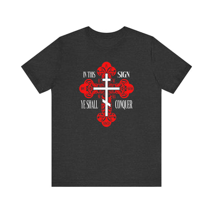 Dark Grey Heather unisex tee featuring an ornate Orthodox cross with “In This Sign Ye Shall Conquer,” “ICXC NIKA,” and “Jesus Christ Conquers”—a bold Christian symbol of faith and victory.