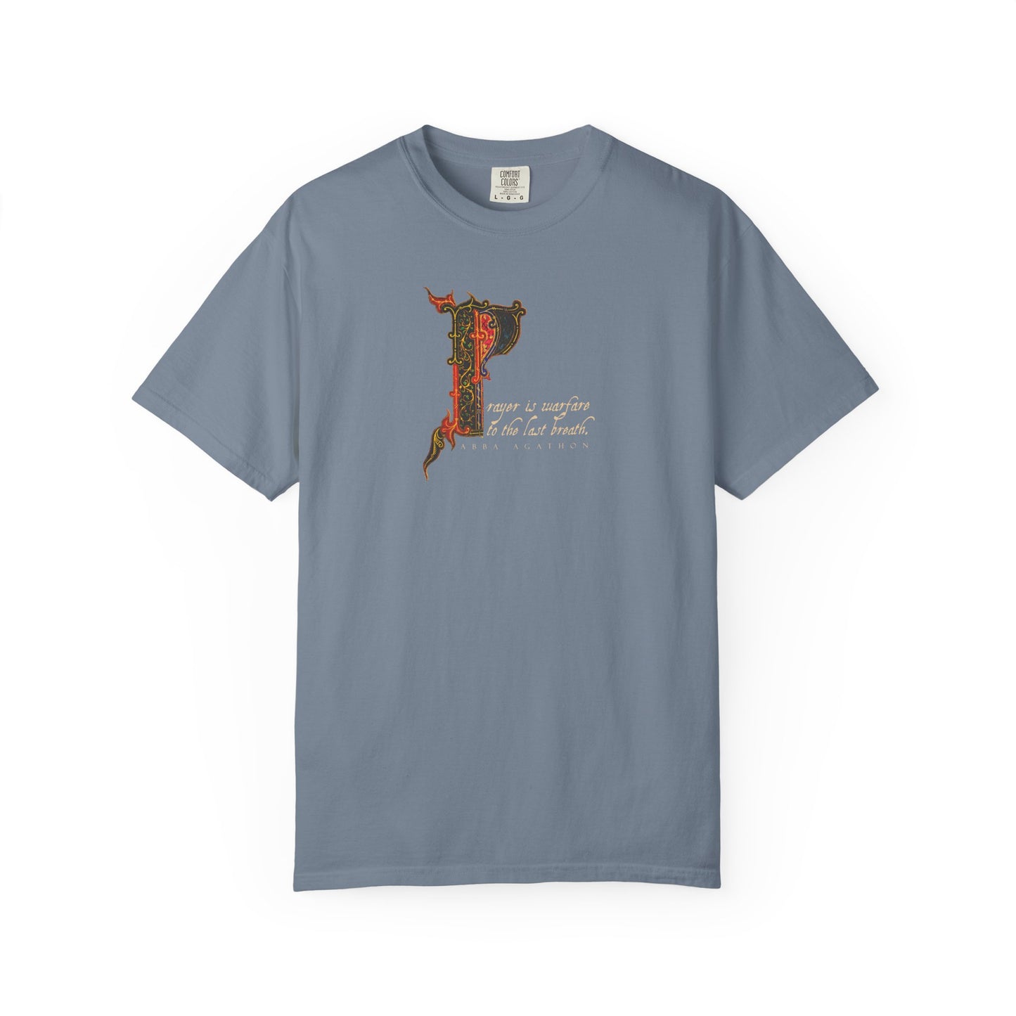 Blue Jean heavyweight cotton unisex tee featuring an ornate letter "P" and cursive script on the chest, inspired by Abba Agathon and the tradition of prayer as spiritual warfare among the Desert Fathers; displayed against a white background.