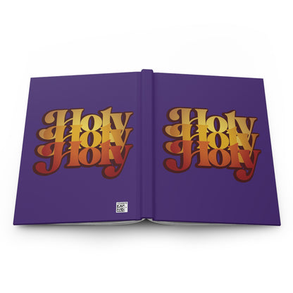 A purple hardcover journal titled "Holy Holy Holy Trisagion Liturgical Prayer" with 70s-style yellow and orange text, inspired by Isaiah 6, Cherubim & Seraphim prayer, and Orthodox tradition.