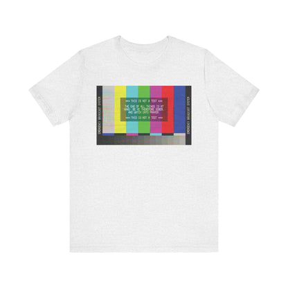 Ash-colored unisex tee featuring an Emergency Broadcast System TV graphic with the message "The End of All Things Is At Hand (1 Peter 4:7)," celebrating apocalyptic Christian themes of humility and kindness.