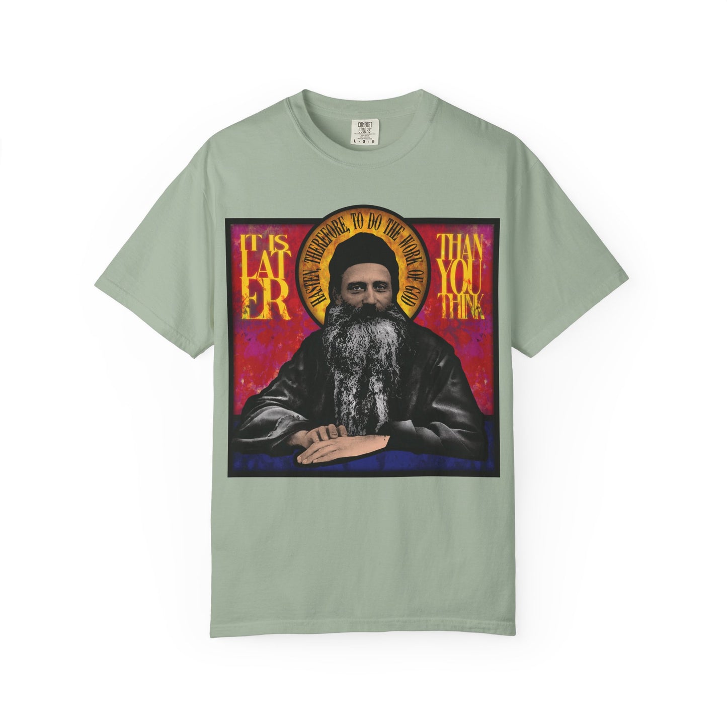 Heavyweight cotton unisex t-shirt with a stained glass design of Fr. Seraphim Rose and the phrase "It Is Later Than You Think," referencing an American Orthodox monastic saint and the promise of the Kingdom of Heaven.
