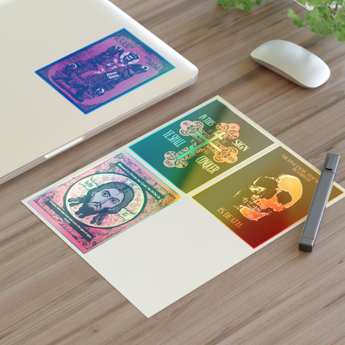 Bestseller Orthodox Sticker Mix No. 3 on a desk beside a laptop, mouse, pen, and plant.
