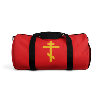 A Christian gym duffel bag featuring a yellow Orthodox cross on a red background—the Precious and Life-Giving Weapon of Unseen Warfare, Scourge of Demons—perfect for showcasing your faith.