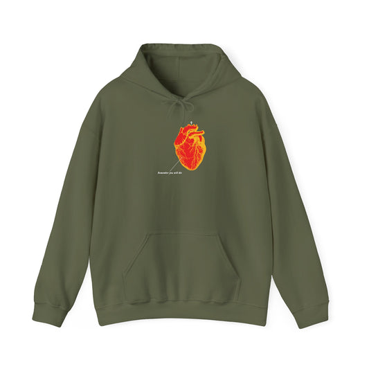 Military green hoodie with an inverted red and orange anatomical heart design and small white text. “Remember You Will Die” retro medical textbook art, a memento mori reflecting life, death, and the afterlife in Orthodox Christian tradition.