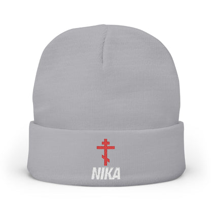 Gray knit beanie featuring a red Orthodox cross and "NIKA" in white, inspired by Orthodox iconography, embroidered on the front. NIKE logo mashup for an athletic aesthetic.