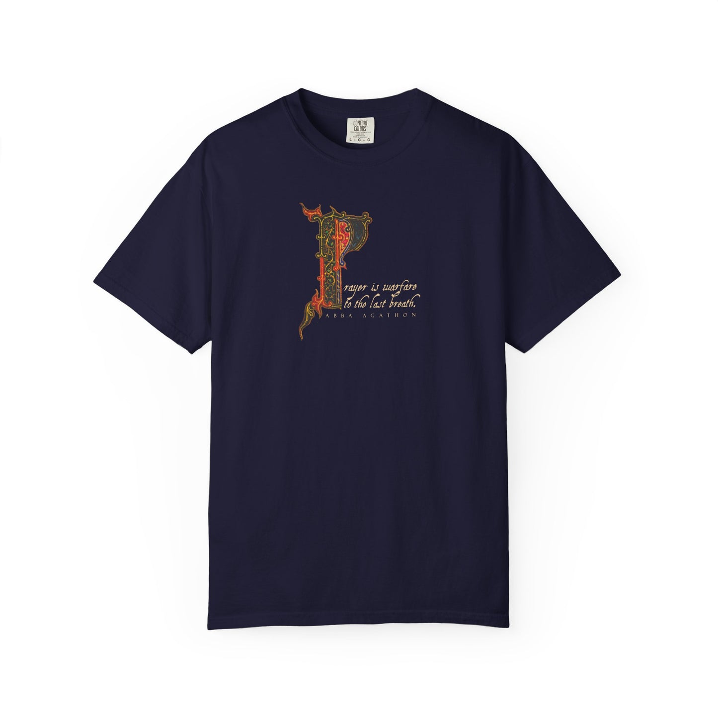 True navy heavyweight cotton unisex tee featuring an illuminated manuscript-inspired ornate letter P and cursive text, drawing inspiration from Abba Agathon’s teaching that “prayer is warfare to the last breath”—a subtle tribute to spiritual discipline in the tradition of the Desert Fathers.