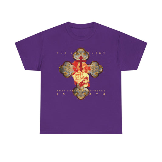 Purple heavy cotton t-shirt with metallic gothic cross, rose, and skull design; features "The Final Enemy That Shall Be Destroyed Is Death (1 Cor 15:26)"—a bold Christian statement on resurrection hope.