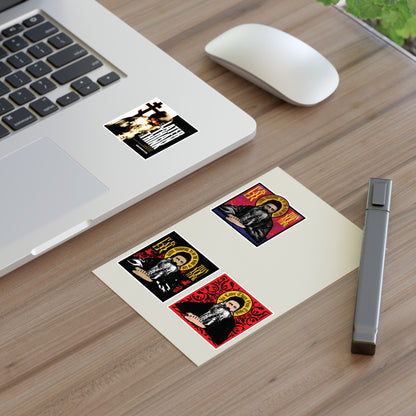 Fr Seraphim Rose Four Sticker Sheet No. 1 on a desk near a laptop with colorful saint stickers and a cross.