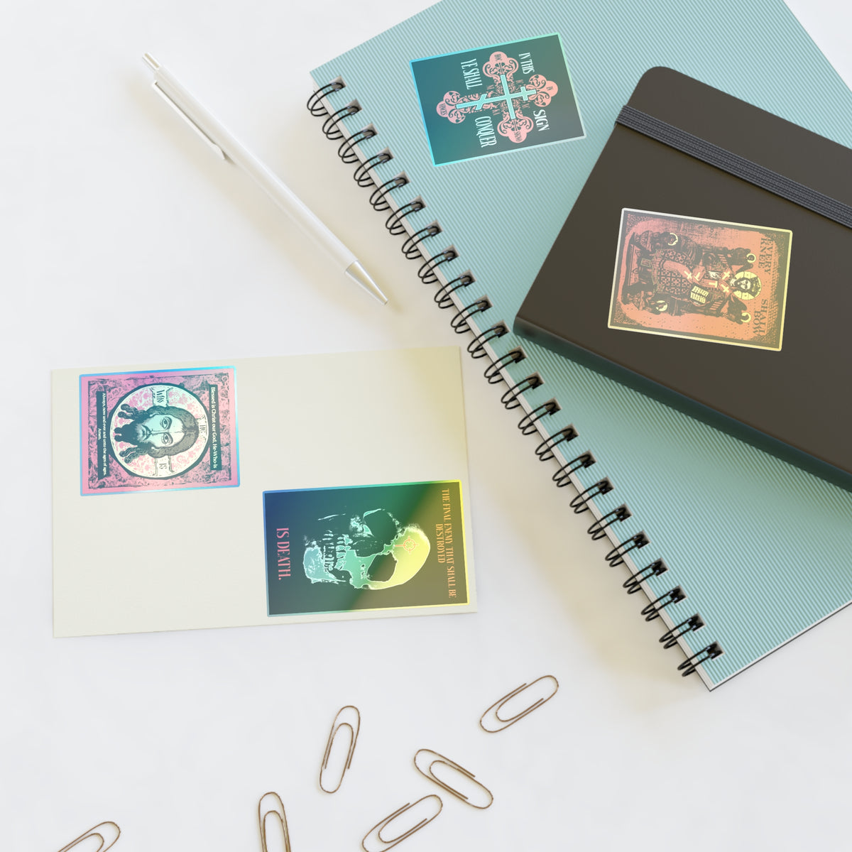 Two notebooks, pen, notecard, clips with Bestseller Orthodox Sticker Mix No. 3 on a white surface.