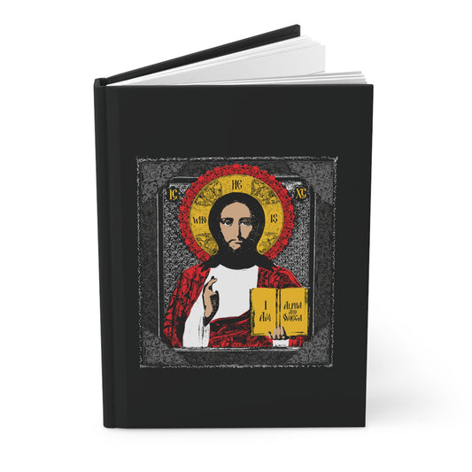The "Christ Pantocrator Icono-Graphic" Orthodox Christian hardcover journal features an icon-style image of Jesus Christ on a black cover, holding a book and gesturing as the Alpha and Omega.