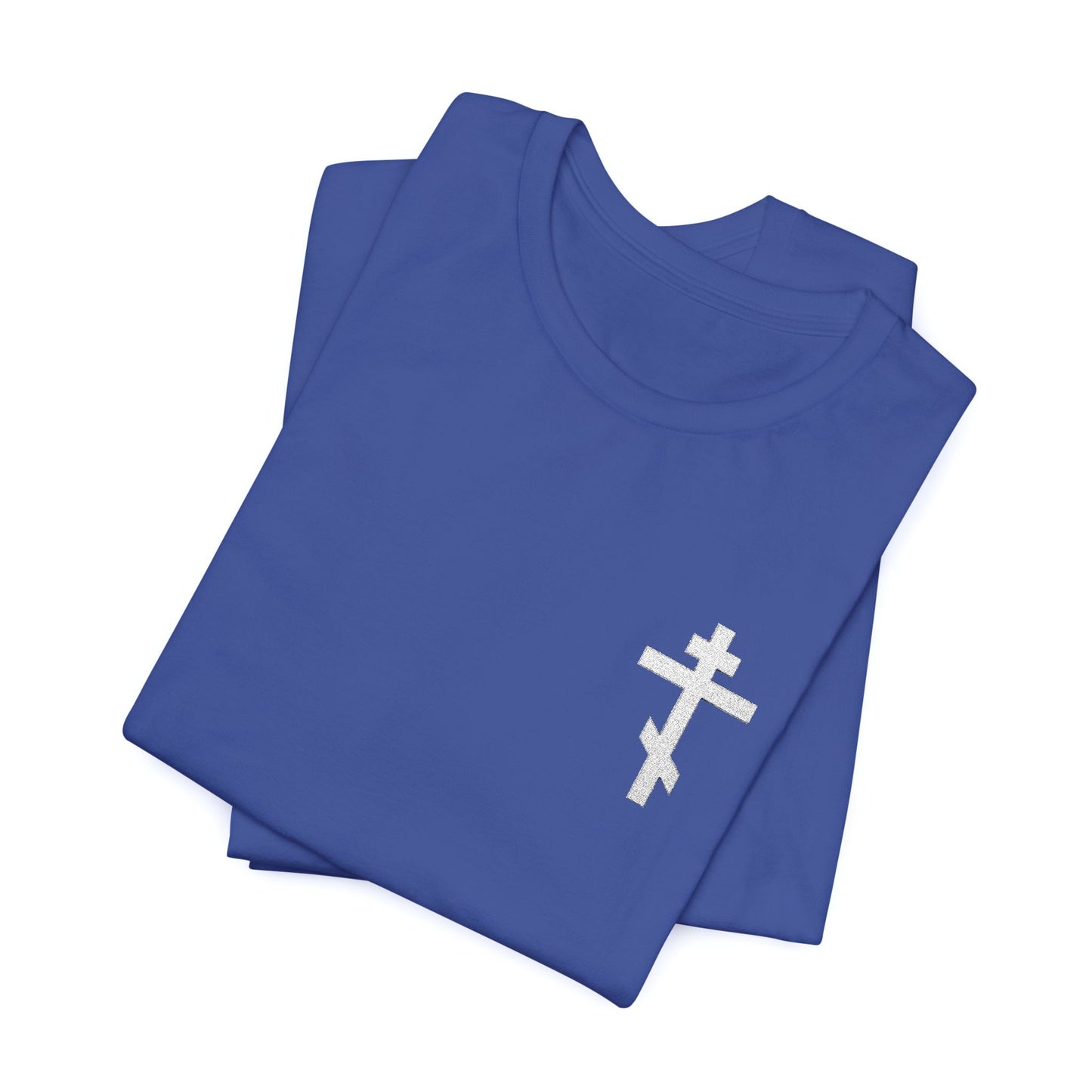 Small blue T-shirt with white embroidered Orthodox cross and “May I Never Boast Except in the Cross of Our Lord Jesus Christ” (Gal 6:14), expressing Christian faith.