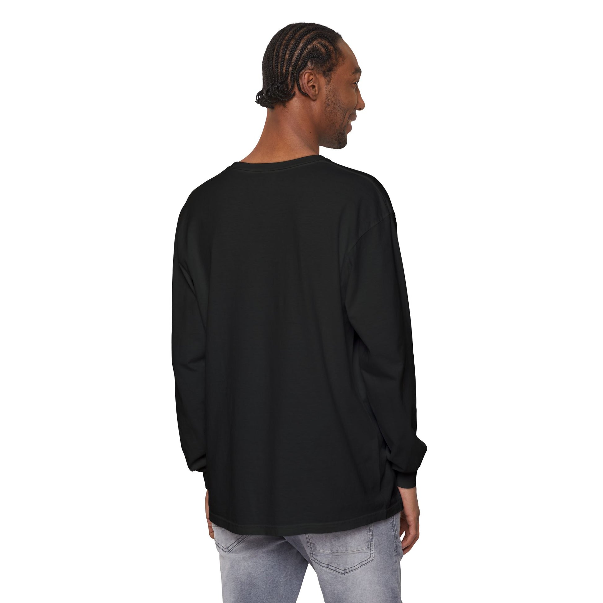 Man with braided hair wears the "King of Kings Crown of Thorns | The King of Glory | Christ is King | Revelation 19:16" Christian Cotton Long Sleeve Shirt in black, styled with light jeans, standing on a white background.
