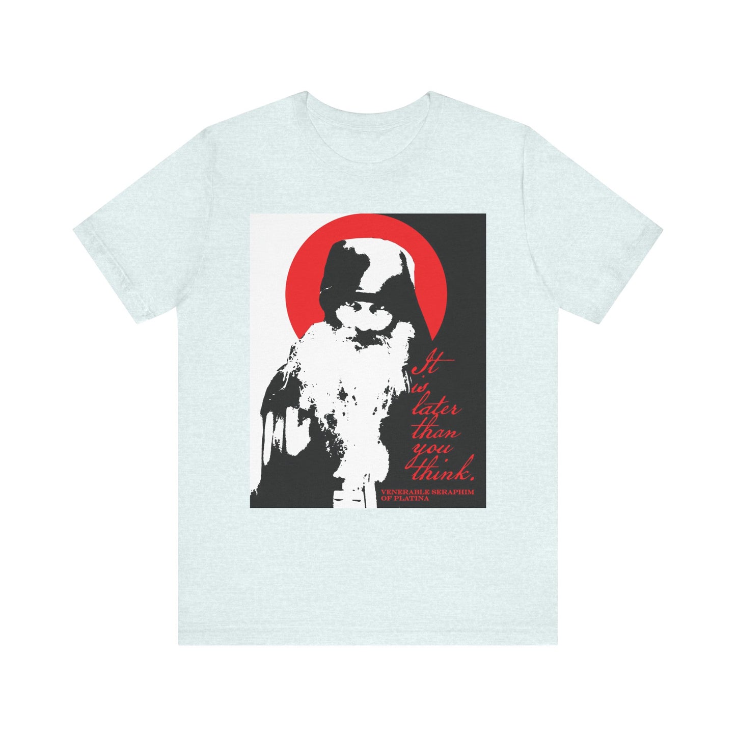 Heather Ice Blue lightweight cotton unisex t-shirt featuring a high-contrast black, white, and red graphic of Fr Seraphim Rose with the phrase "It is later than you think"—a subtle memento mori reflecting Orthodox spiritual urgency.