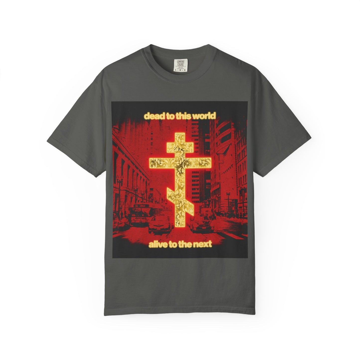 Pepper-colored heavyweight cotton unisex tee—Dead to This World Alive to the Next—featuring a glowing gold cross, striking red cityscape, and bold Orthodox Christian message inspired by St Ignatius, reflecting destiny, death, and eternity.