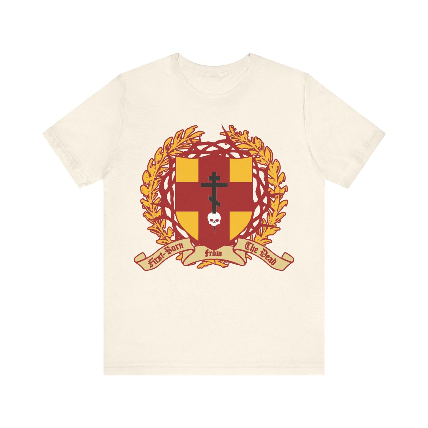 Natural cotton tee featuring an Orthodox cross piercing a skull, shield with victory wreath and crown of thorns, and "First-Born from the Dead" (Col 1:18)—symbolizing victory over death through Christ.