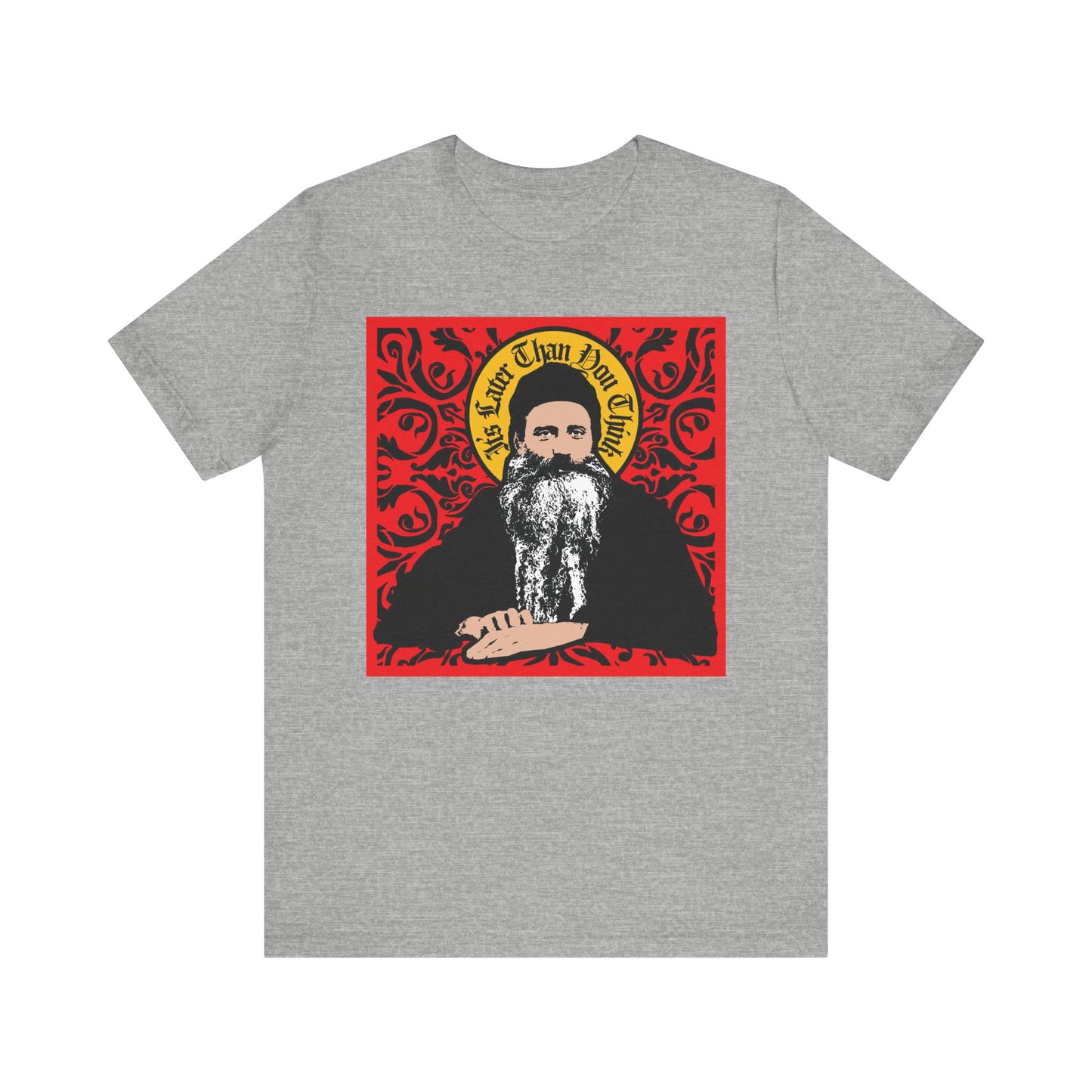 Athletic Heather unisex tee featuring a Saint Seraphim Rose of Platina icono-graphic design with ornate red and yellow details. "It's Later Than You Think" message. Lightweight cotton for comfort.