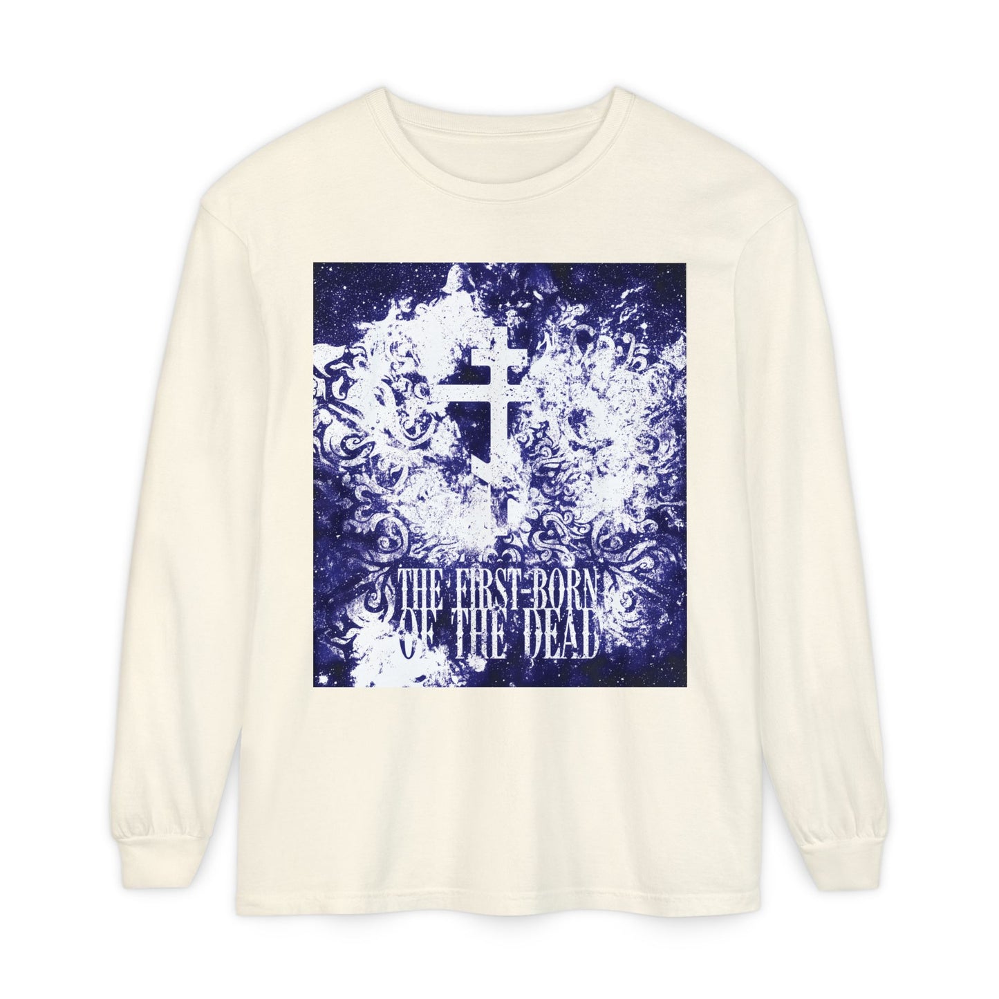 Ivory long-sleeve cotton shirt featuring a glowing white and blue textured cosmic Orthodox cross, with “The First-Born of the Dead” referencing Christ's resurrection and message to the seven churches.