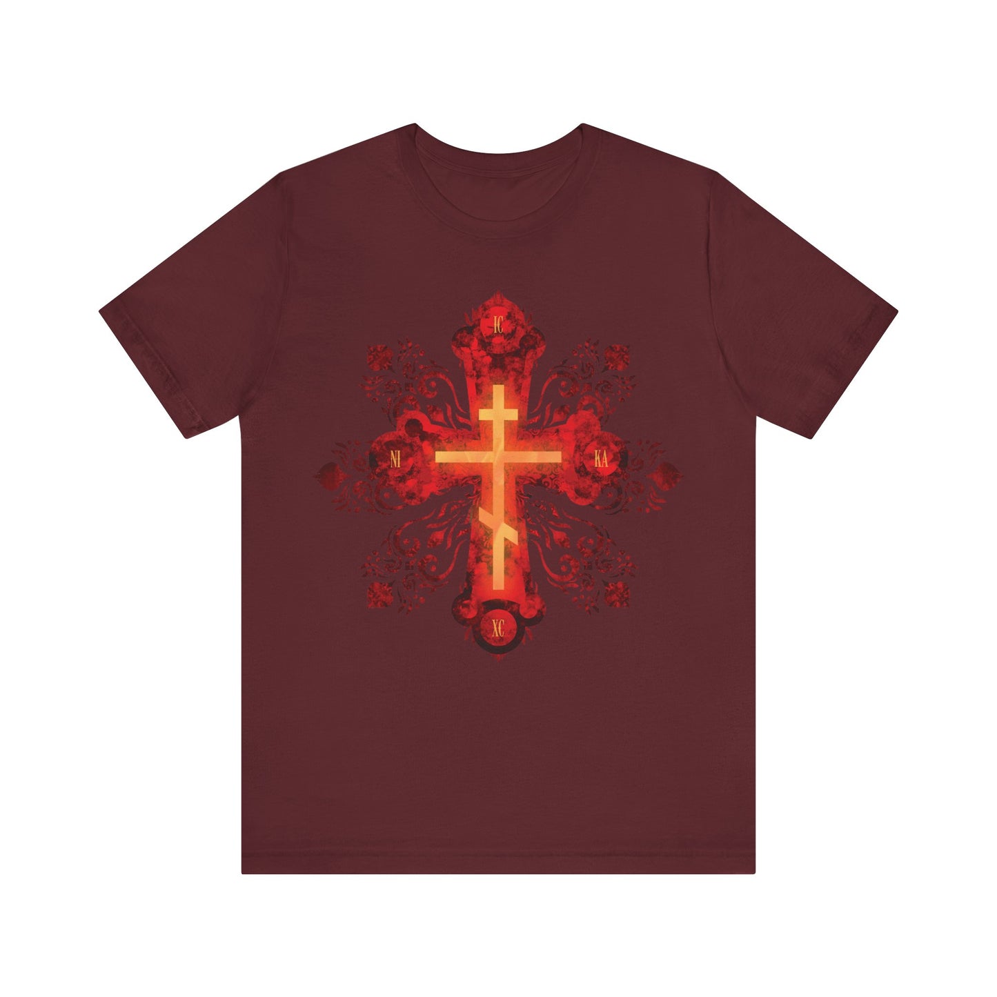 Maroon unisex cotton tee featuring a red and gold ornate Russian-style Orthodox cross with floral and skull motifs, inspired by Christian faith and St. Herman of Alaska. Text: “He was pierced for our transgressions.”.