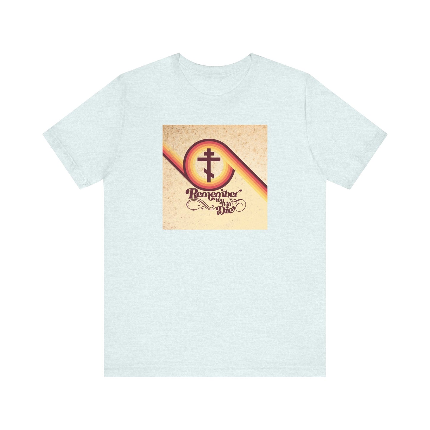 Heather ice blue lightweight cotton tee featuring a vintage 70s-inspired cross in a circle and the message "Remember you will die" (Memento Mori), drawing on the Orthodox Christian tradition and the parable of the rich fool from Luke 12:16-21.