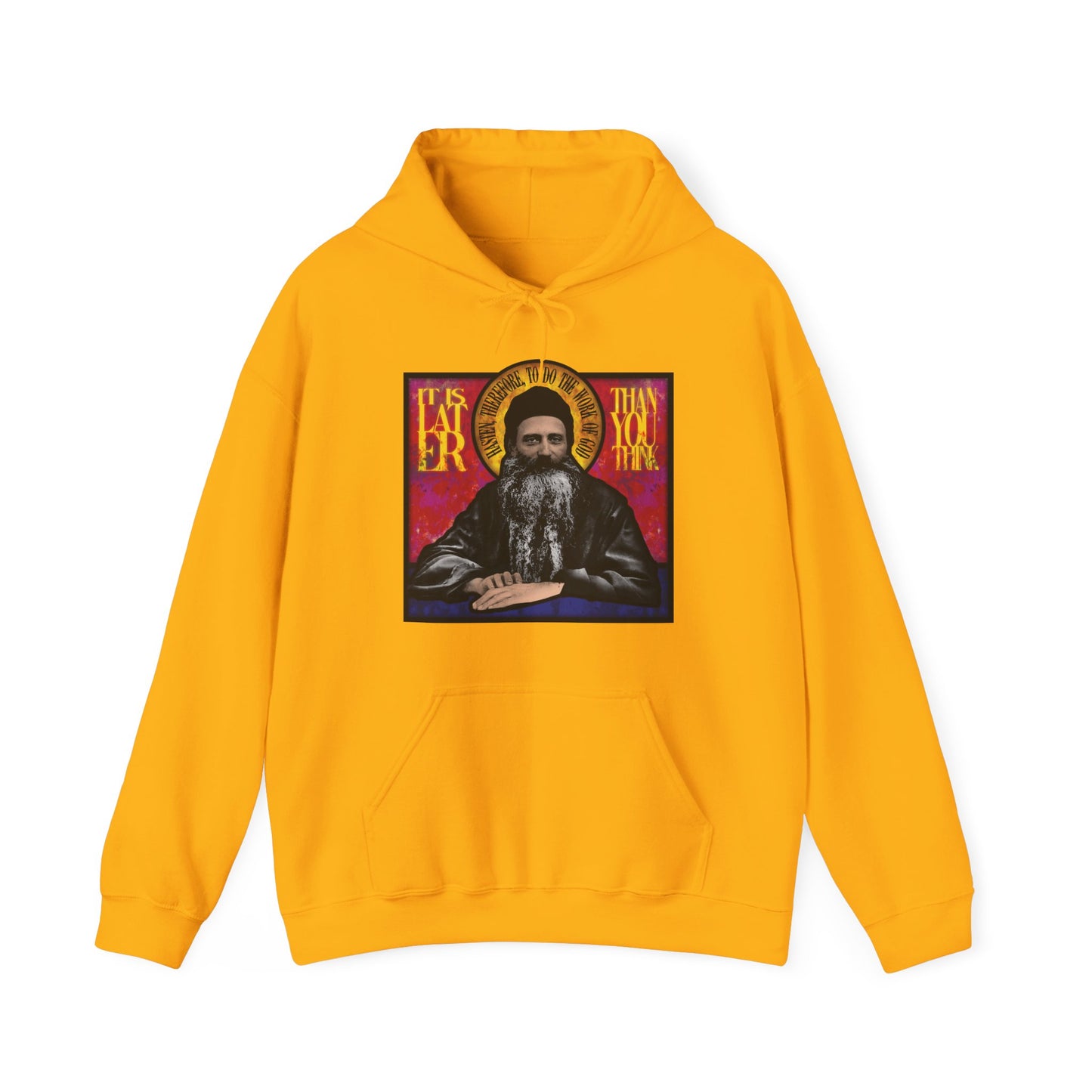 Gold "It Is Later Than You Think" hoodie features Fr. Seraphim Rose in a stained glass design, with text evoking themes of reflection and salvation. American Orthodox style pays homage to this monastic saint.