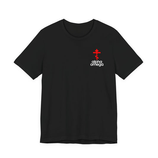 Black cotton t-shirt featuring a small red Orthodox cross and white "alpha & omega" text on the upper left chest, inspired by a minimalist Adidas mashup. Perfect for expressing Orthodox Christian faith.