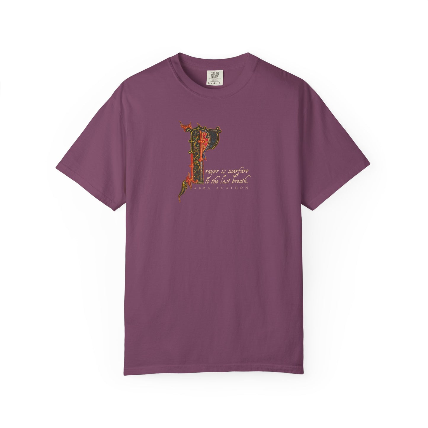 Berry-colored heavyweight cotton unisex tee featuring an ornate letter "P" and small decorative text inspired by prayer and spiritual warfare, with a design based on Abba Agathon and the Desert Fathers in the style of an illuminated manuscript.