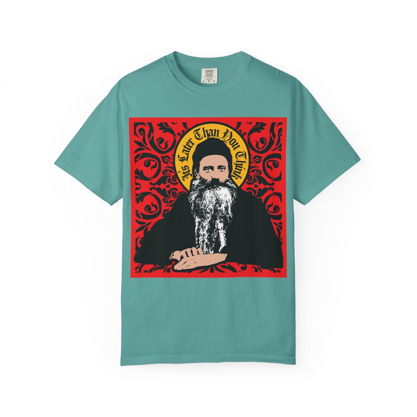 Seafoam T-shirt featuring a Saint Seraphim Rose of Platina icono-graphic style illustration with a red ornate background and the phrase "It's Later Than You Think" above his head—this heavyweight cotton unisex tee honors respected figures in Orthodox Christianity.