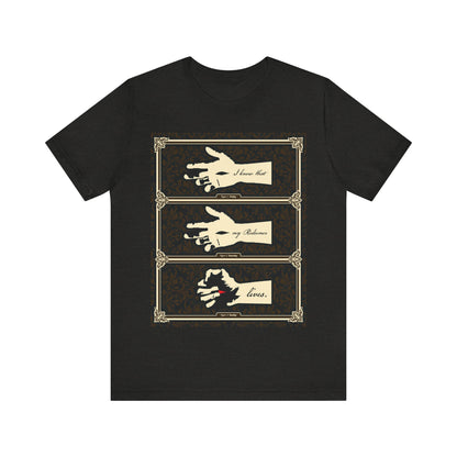 Black Heather t-shirt featuring earthtone Americana art: the crucified Christ’s hand and text “I Know That My Redeemer Lives” (Job 19:25), reflecting resurrection and Orthodox Christian faith.