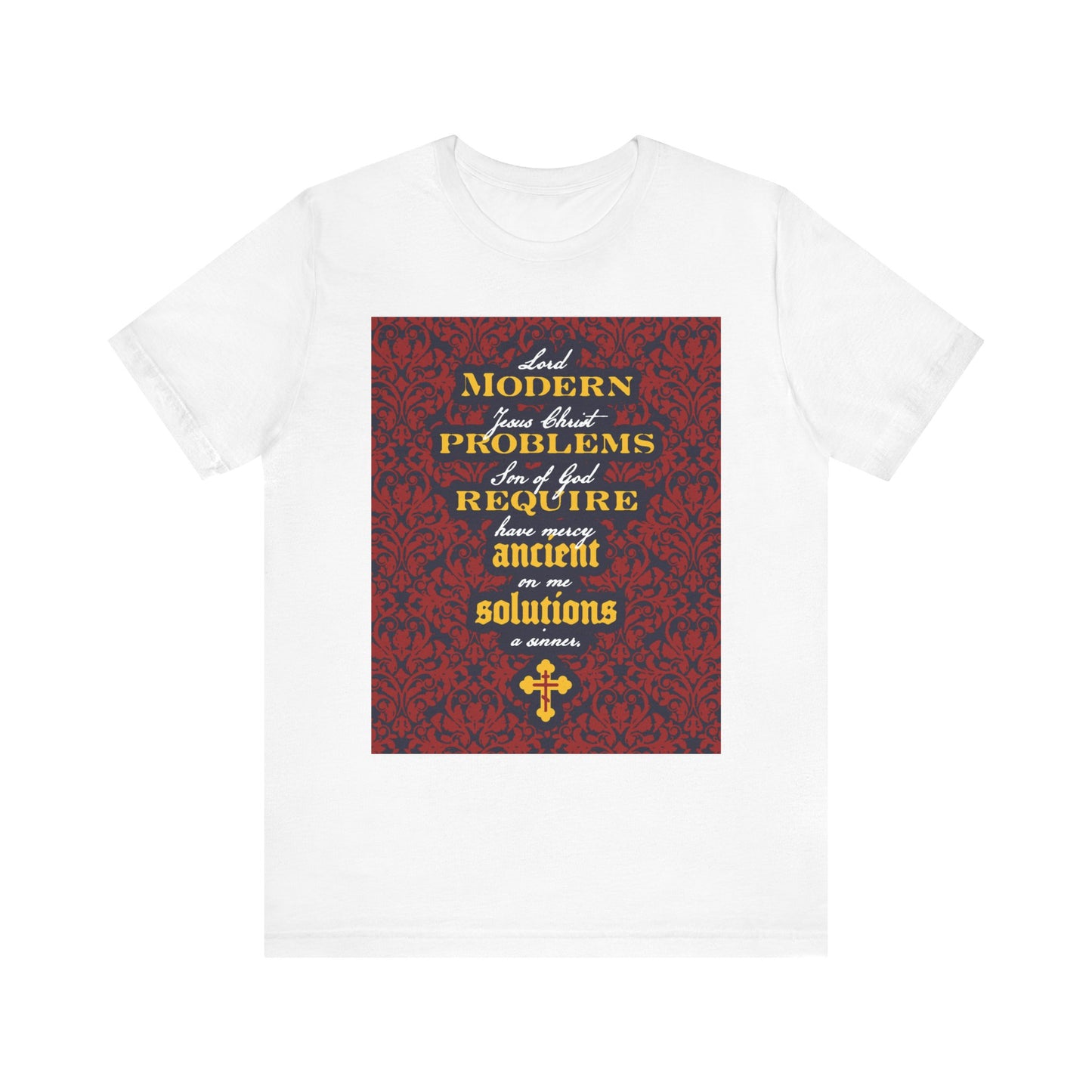 White t-shirt featuring a floral background and the inspirational message "Modern Problems Require Ancient Solutions" referencing the Jesus Prayer, printed in yellow and white text on the front.