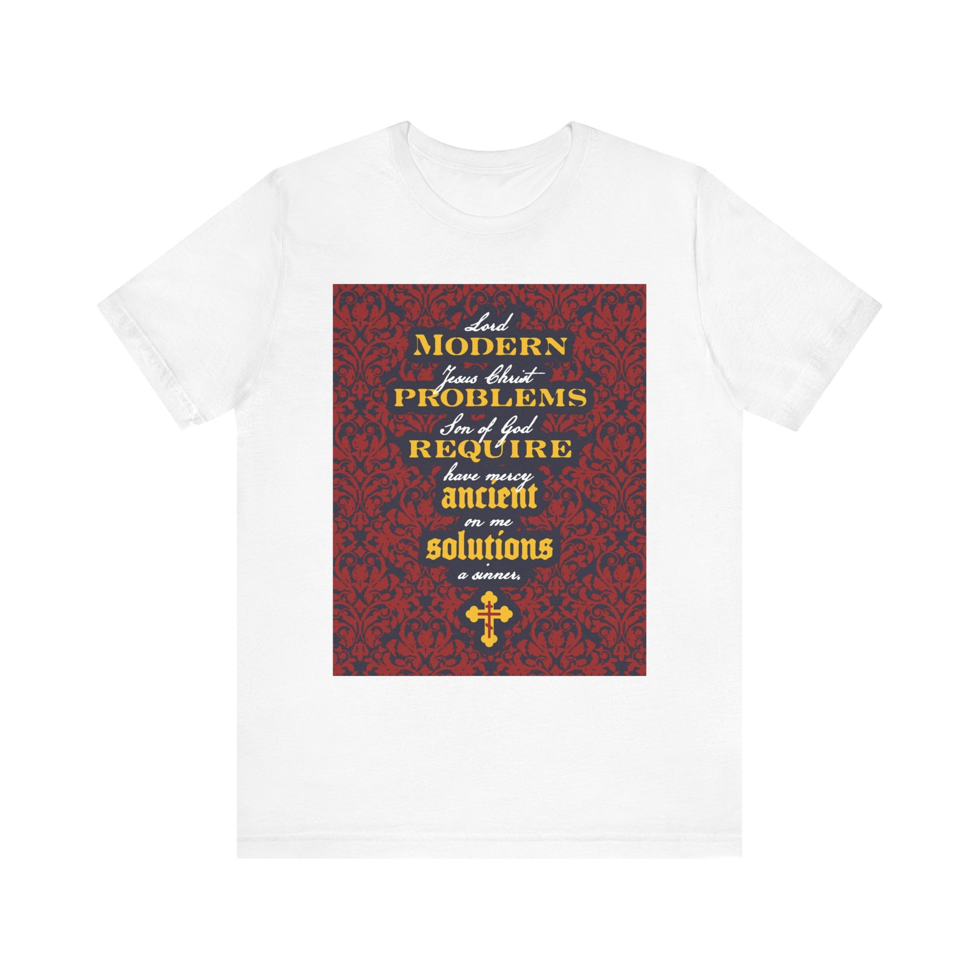 White t-shirt featuring a floral background and the inspirational message "Modern Problems Require Ancient Solutions" referencing the Jesus Prayer, printed in yellow and white text on the front.